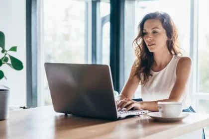 An image of cute girl working on laptopn