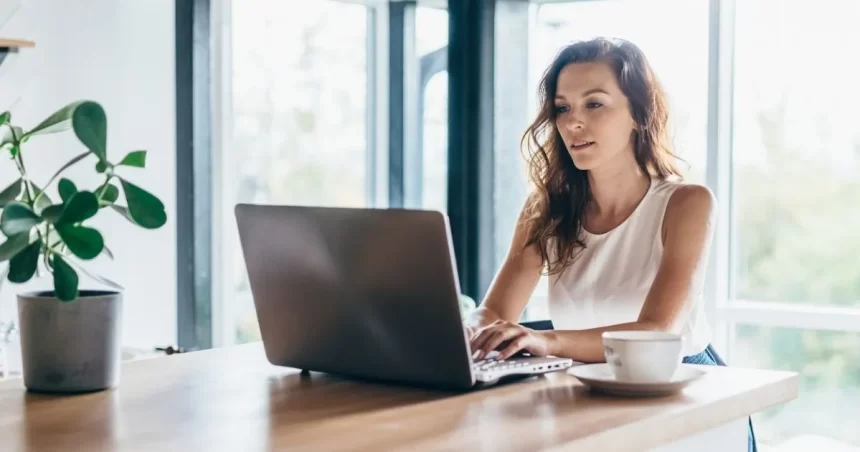 An image of cute girl working on laptopn