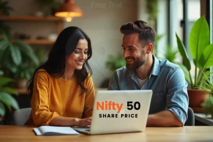 A man and a woman discussing IRFC shares with a laptop open in front of them on a table